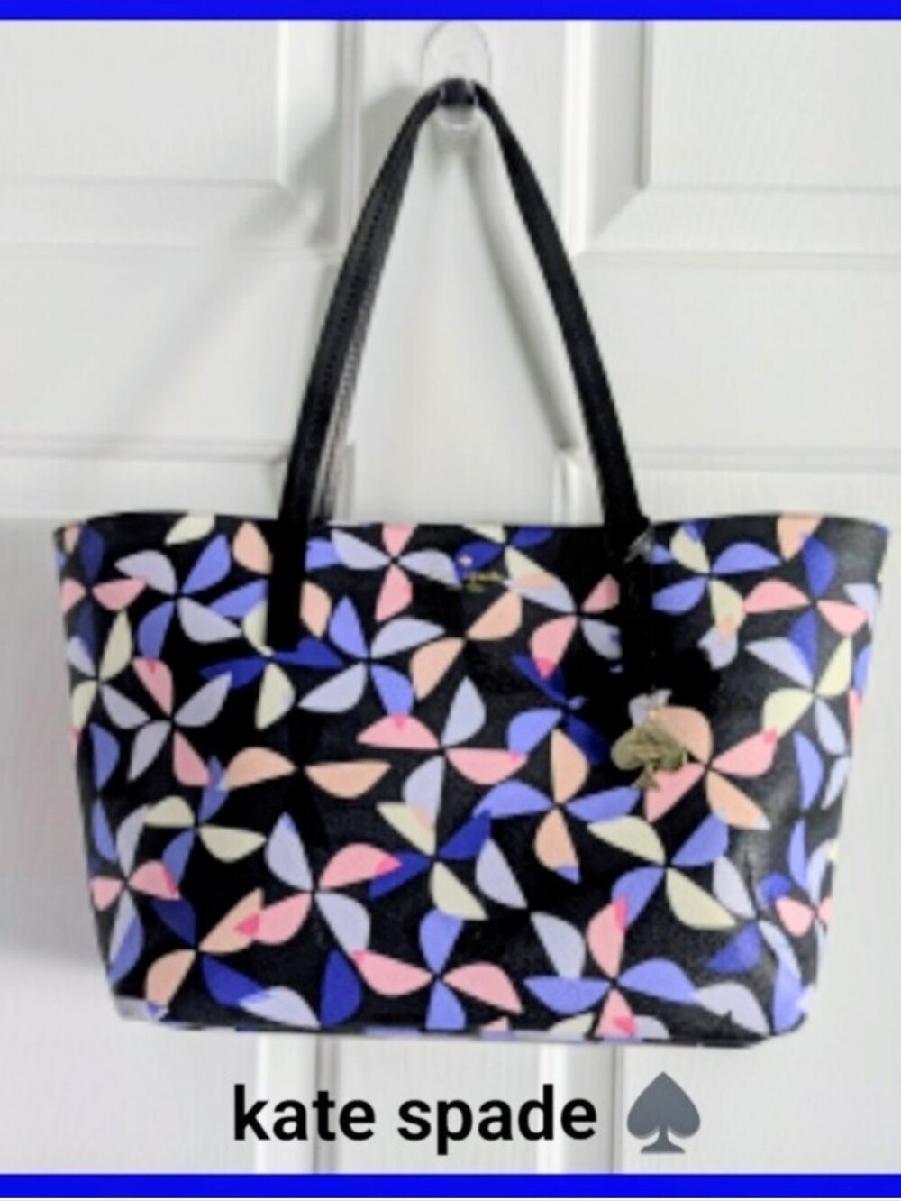 Kate Spade Hawthorne LaneSpinner Ryan Bag. Navy background Multi colored pink